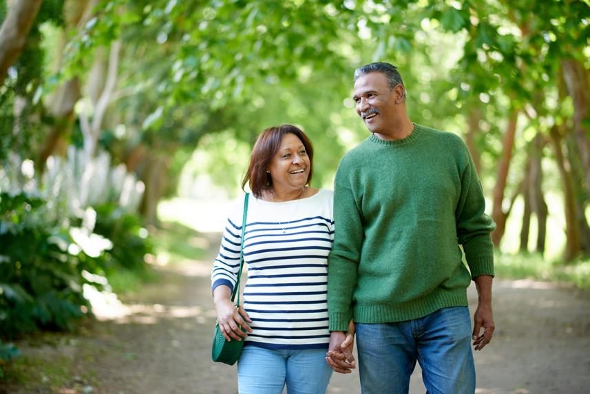 Senior couple walking outside