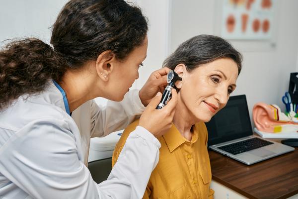Doctor looking into a patients ear