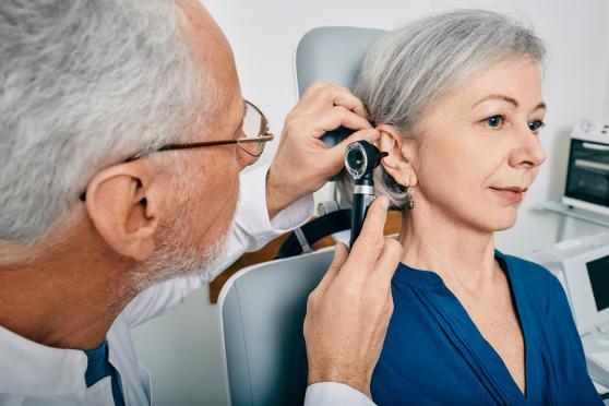 Doctor checking a patients ear